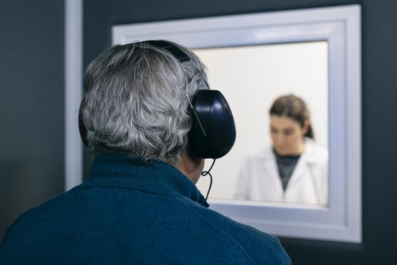 Man in a hearing test, wearing headphones